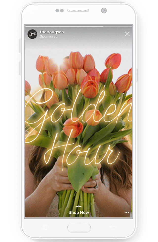 An Instagram Story from the account 'thebouqsco' depicting a photo of a bouquet of tulips with text reading 'Golden Hour.